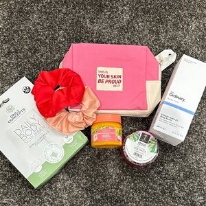 Pink and Cream Cosmetic Bag with Assorted Skincare Products